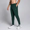 Moške športne hlače Training Woven MP – temno smaragdne
