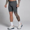 MP moške kratke trenirke Hybrid Pocket Half Tight - temno siva/zelena